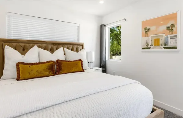 a bathroom with a double vanity sink toilet and shower