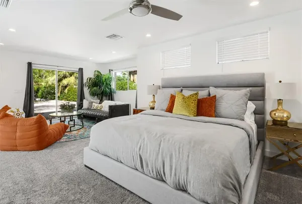 a bedroom with a bed and a dresser