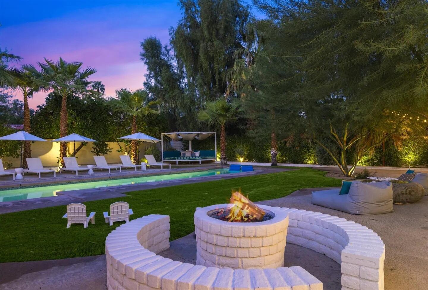 72382 Desert Drive Rancho Mirage, CA 92270 - Photo 6 of 45 a front view of a house with garden and sitting area