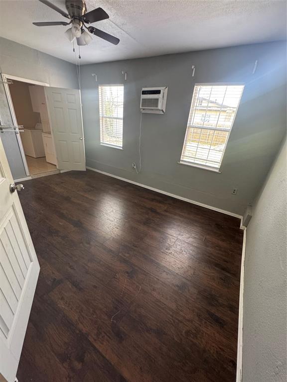 629 Harrison Lane Hurst, TX 76053 - Photo 2 of 20 an empty room with wooden floor and windows