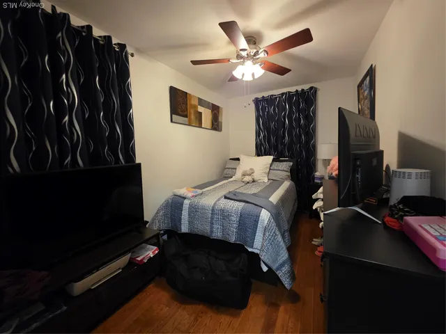 a bedroom with a bed window and a walk in closet