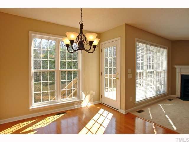 1401 Lynn Road Raleigh, NC 27612 - Photo 4 of 12 Formal dining area with hardwoods walks out to the oversized deck.
