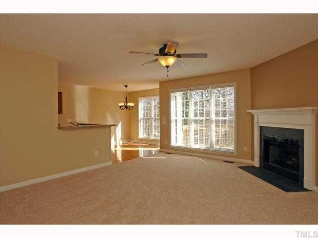 1401 Lynn Road Raleigh, NC 27612 - Photo 5 of 12 Spacious family room with corner gas fireplace.