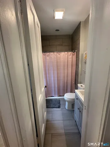 a bathroom with a bathtub and a toilet