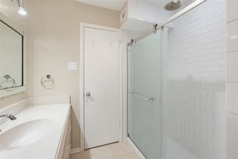 a bathroom with a tub and a sink