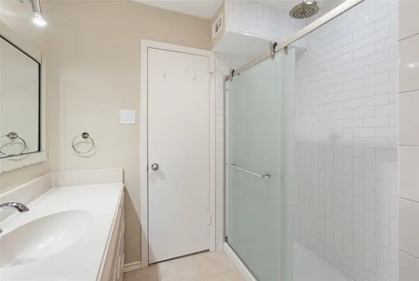 a bathroom with a tub and a sink