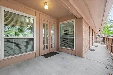 a view of a street with a car park front of a house