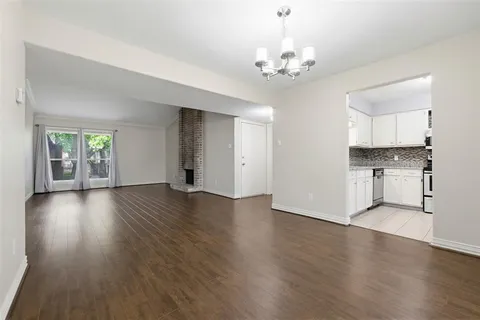 a view of a kitchen with a dishwasher cabinets and wooden floor