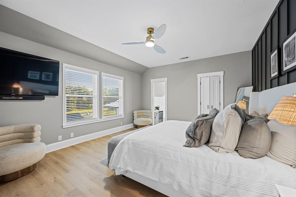 533 Camp Creek Road Rockwall, TX 75087 - Photo 23 of 40 a bedroom with a bed and a flat screen tv