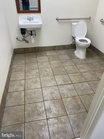 a view of hallway with a bathroom