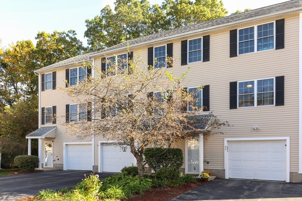 81 Salem Road, Unit 92 Billerica, MA 01821 - Photo 1 of 32 a front view of a house with a garden