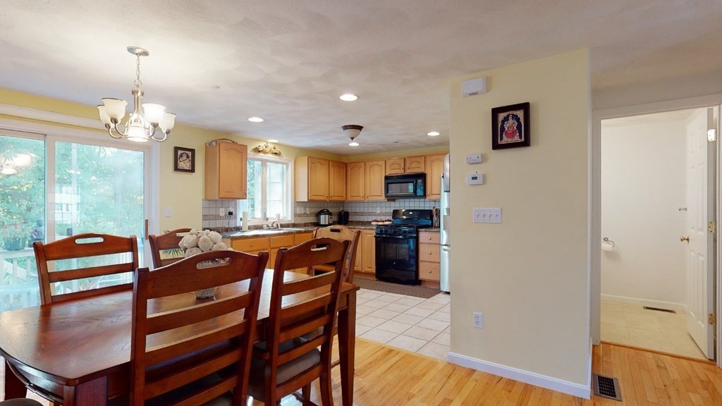 81 Salem Road, Unit 92 Billerica, MA 01821 - Photo 11 of 32 a large kitchen with a table and chairs