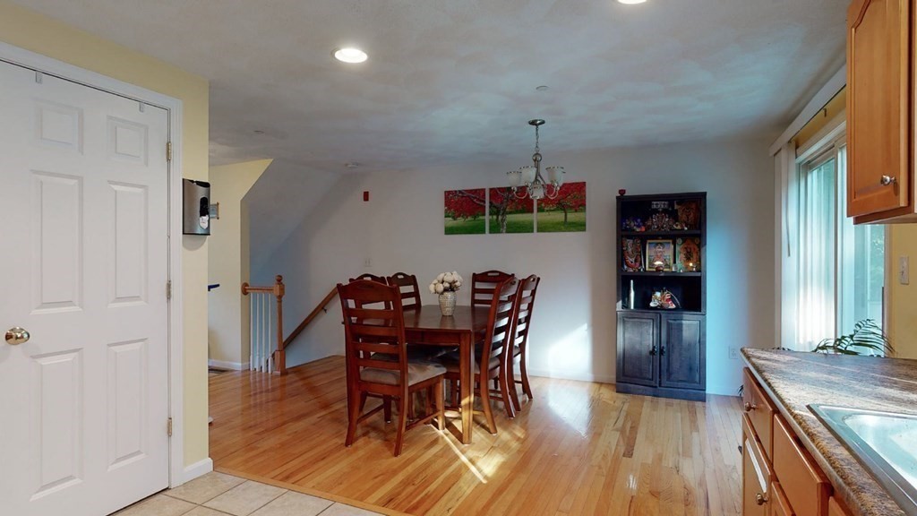 81 Salem Road, Unit 92 Billerica, MA 01821 - Photo 14 of 32 a view of a dining room with furniture and wooden floor