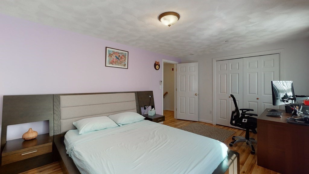 81 Salem Road, Unit 92 Billerica, MA 01821 - Photo 17 of 32 a bedroom with a bed and a desk