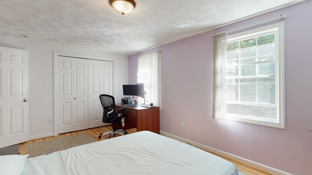 81 Salem Road, Unit 92 Billerica, MA 01821 - Photo 18 of 32 a bedroom with bed and a window
