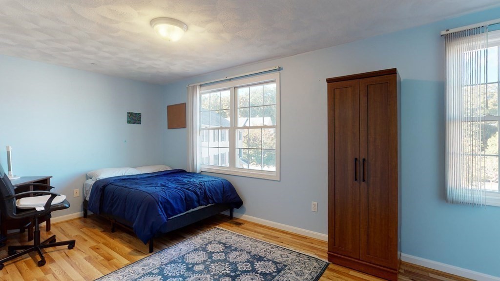 81 Salem Road, Unit 92 Billerica, MA 01821 - Photo 19 of 32 a bedroom with a bed and a window