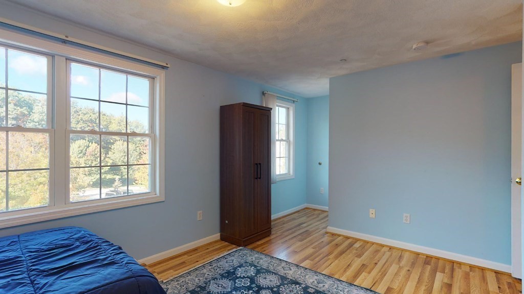 81 Salem Road, Unit 92 Billerica, MA 01821 - Photo 20 of 32 a bedroom with a bed and a window
