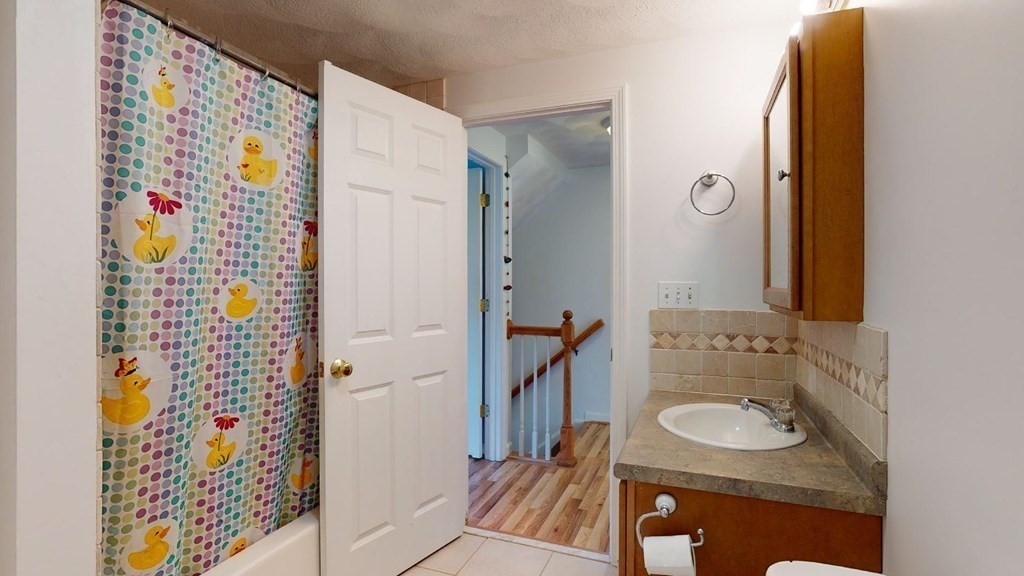 81 Salem Road, Unit 92 Billerica, MA 01821 - Photo 22 of 32 a bathroom with a sink and a mirror