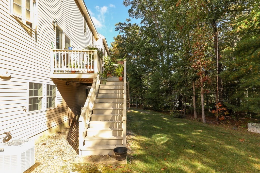 81 Salem Road, Unit 92 Billerica, MA 01821 - Photo 27 of 32 a view of a house with backyard and sitting area