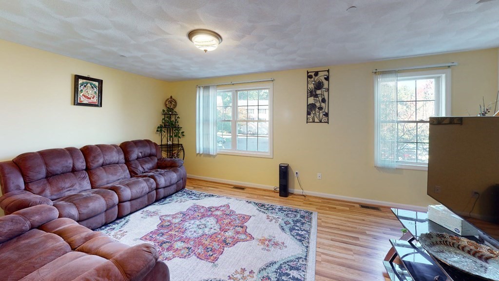 81 Salem Road, Unit 92 Billerica, MA 01821 - Photo 3 of 32 a living room with furniture and a window