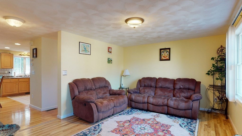 81 Salem Road, Unit 92 Billerica, MA 01821 - Photo 5 of 32 a living room with a couch and a couch