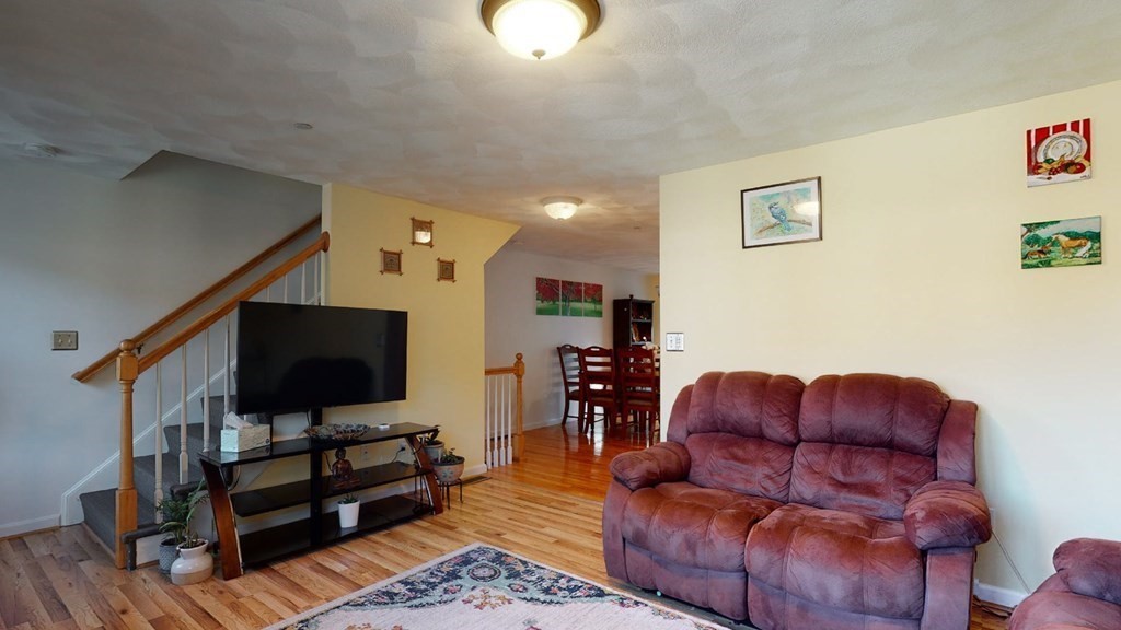 81 Salem Road, Unit 92 Billerica, MA 01821 - Photo 6 of 32 a living room with furniture and a flat screen tv