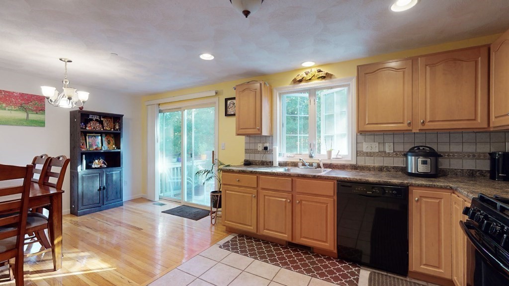 81 Salem Road, Unit 92 Billerica, MA 01821 - Photo 9 of 32 a kitchen with granite countertop lots of counter top space and stainless steel appliances