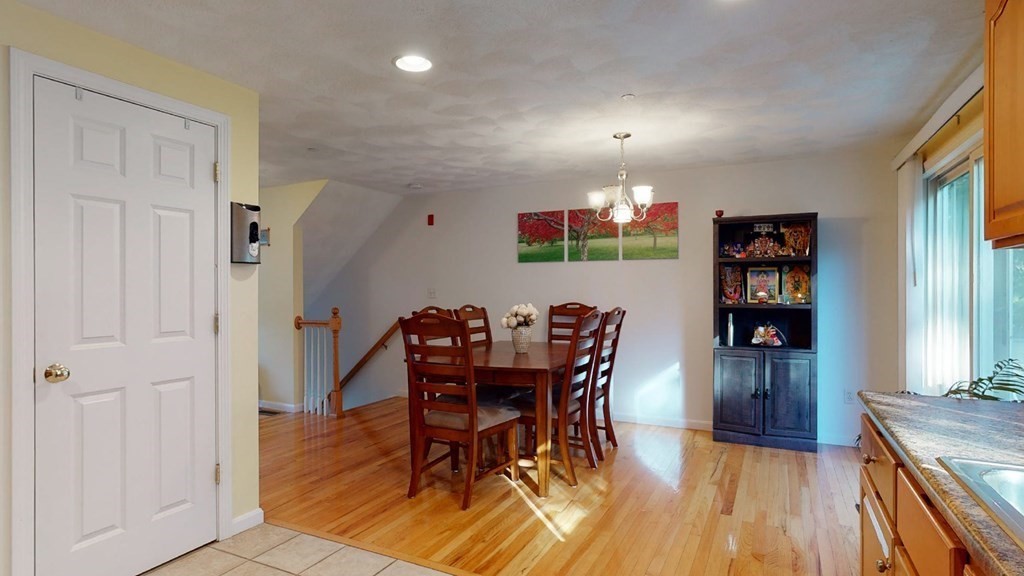 81 Salem Road, Unit 92 Billerica, MA 01821 - Photo 10 of 32 a view of a dining room with furniture and wooden floor