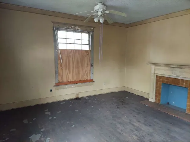 an empty room with a fireplace