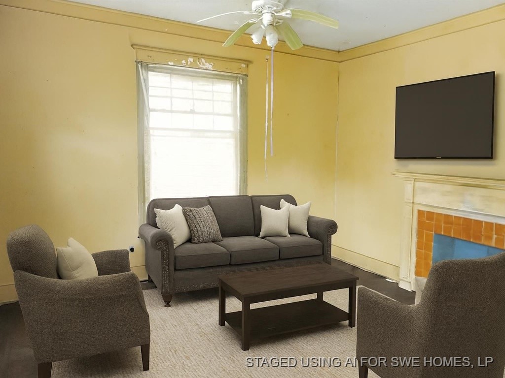 110 Acorn Street Marshall, TX 75670 - Photo 4 of 12 a living room with furniture a flat screen tv and a fireplace