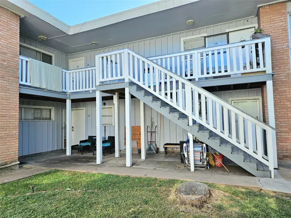 a view of porch with deck wooden floor and stairs