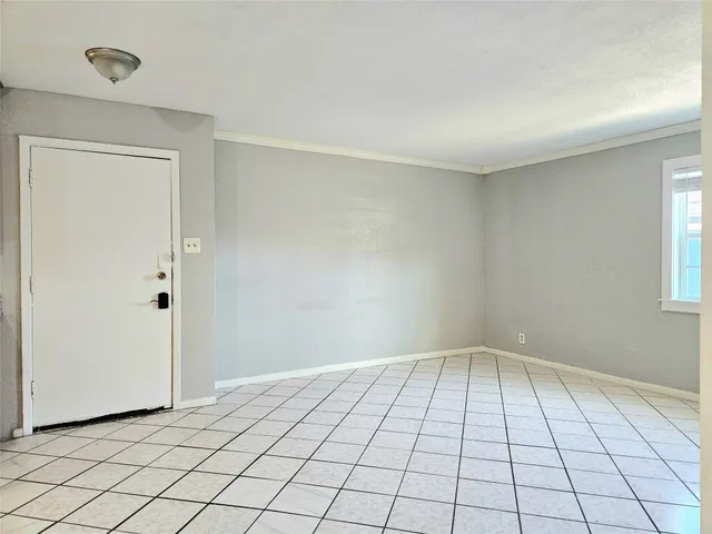 a view of an empty room and window