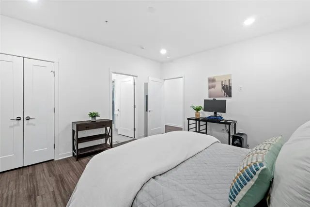 a bedroom with a bed and a table