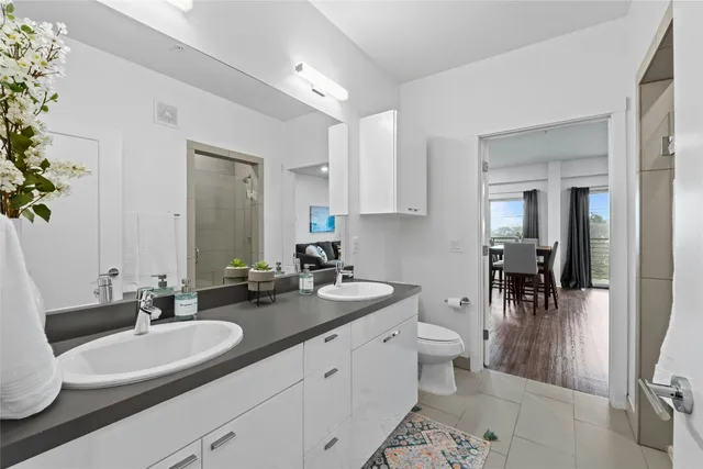 a bathroom with a sink double vanity and a mirror