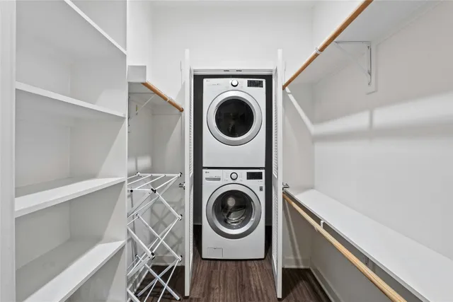 a utility room with sink dryer and washer