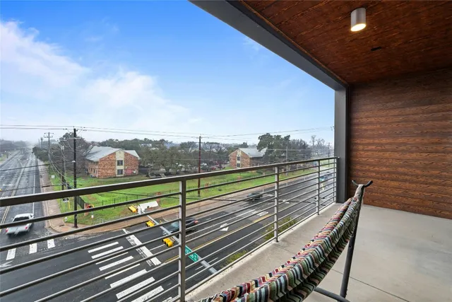a view of a balcony with city view