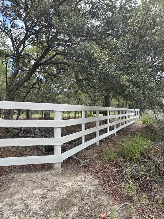 Northeast 81st Street Bronson, FL 32621 - Photo 11 of 13 a view of a yard with wooden fence