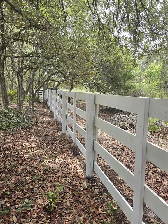 Northeast 81st Street Bronson, FL 32621 - Photo 4 of 13 a view of a wooden fence and trees