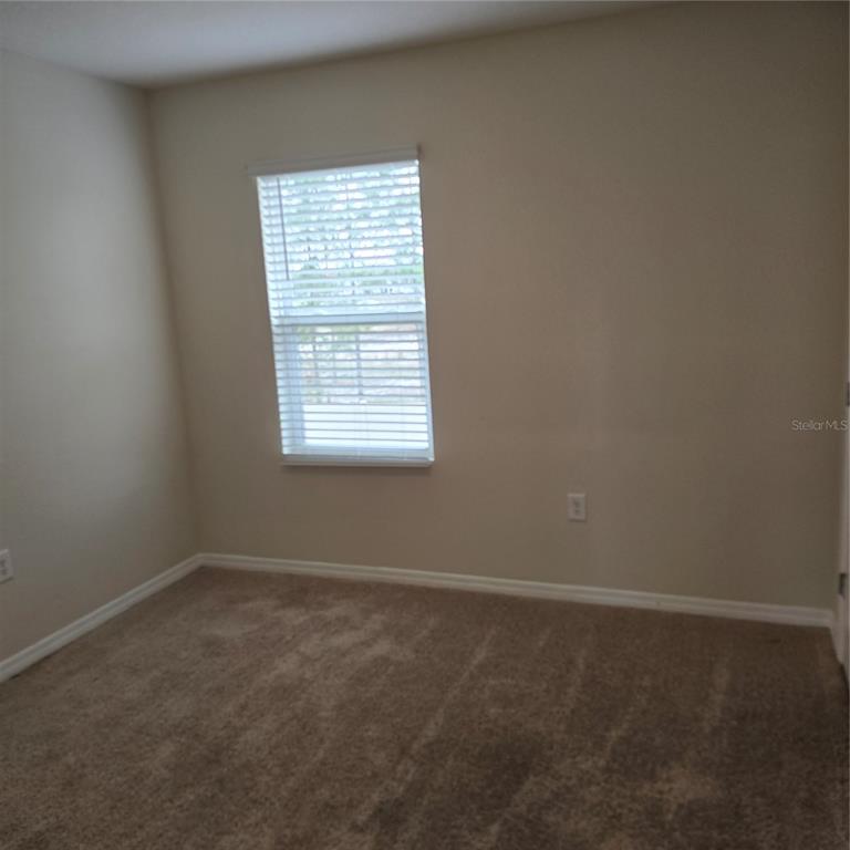 814 Sun Burst Road Winter Haven, FL 33880 - Photo 32 of 48 an empty room with a window