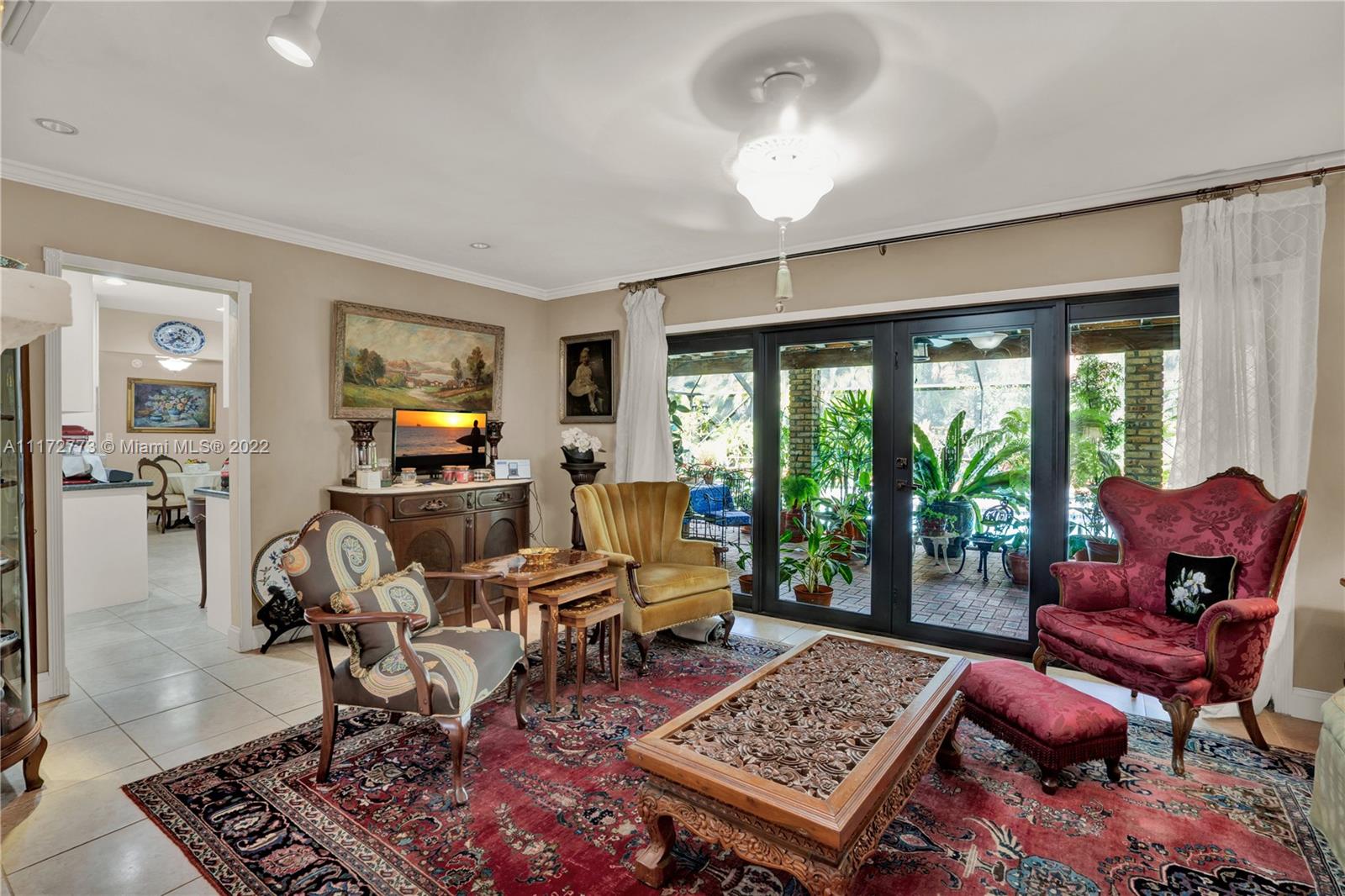 8695 Southwest 110th Street Miami, FL 33156 - Photo 13 of 54 a living room with furniture and a rug