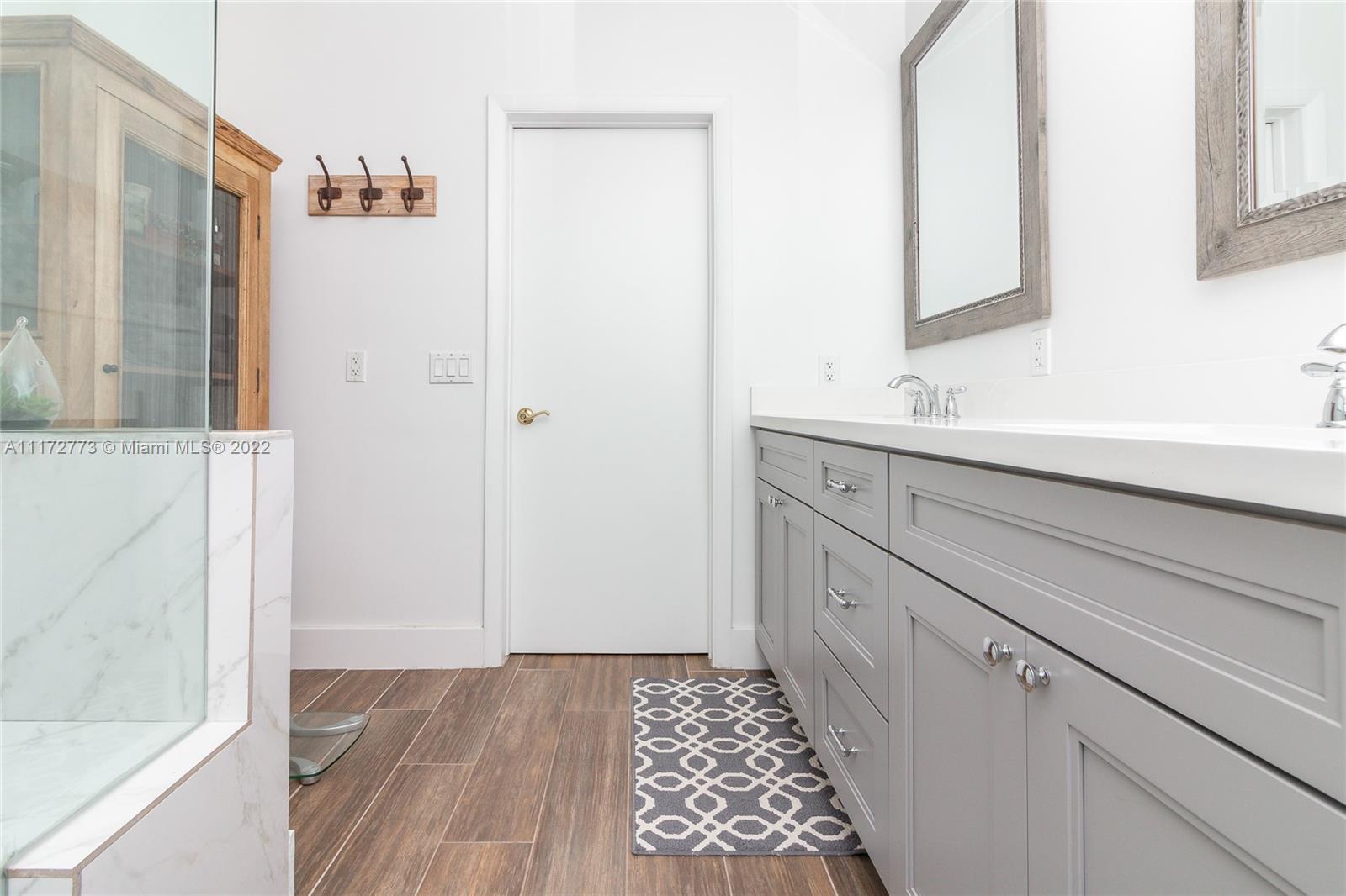 8695 Southwest 110th Street Miami, FL 33156 - Photo 14 of 54 a bathroom with a sink and a mirror
