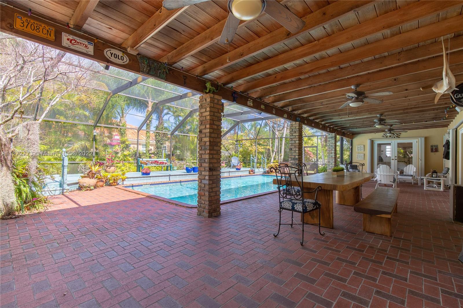 8695 Southwest 110th Street Miami, FL 33156 - Photo 23 of 54 a view of a porch with chairs and backyard