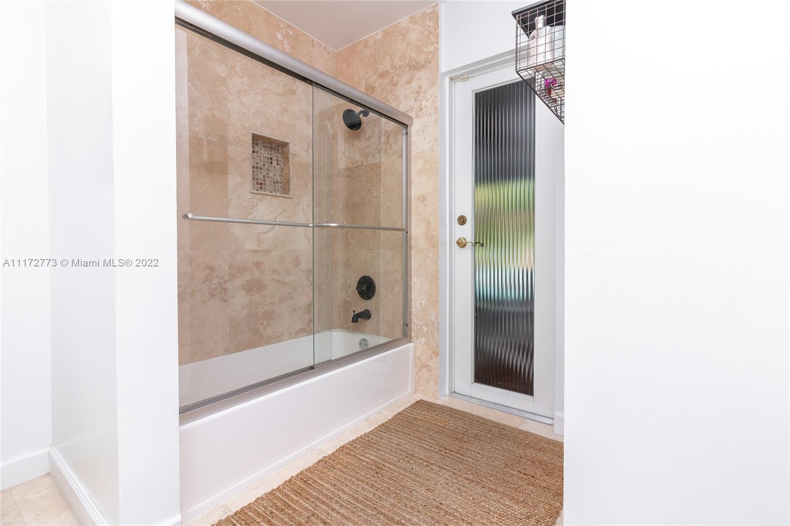 8695 Southwest 110th Street Miami, FL 33156 - Photo 27 of 54 a bathroom with a bathtub and a shower