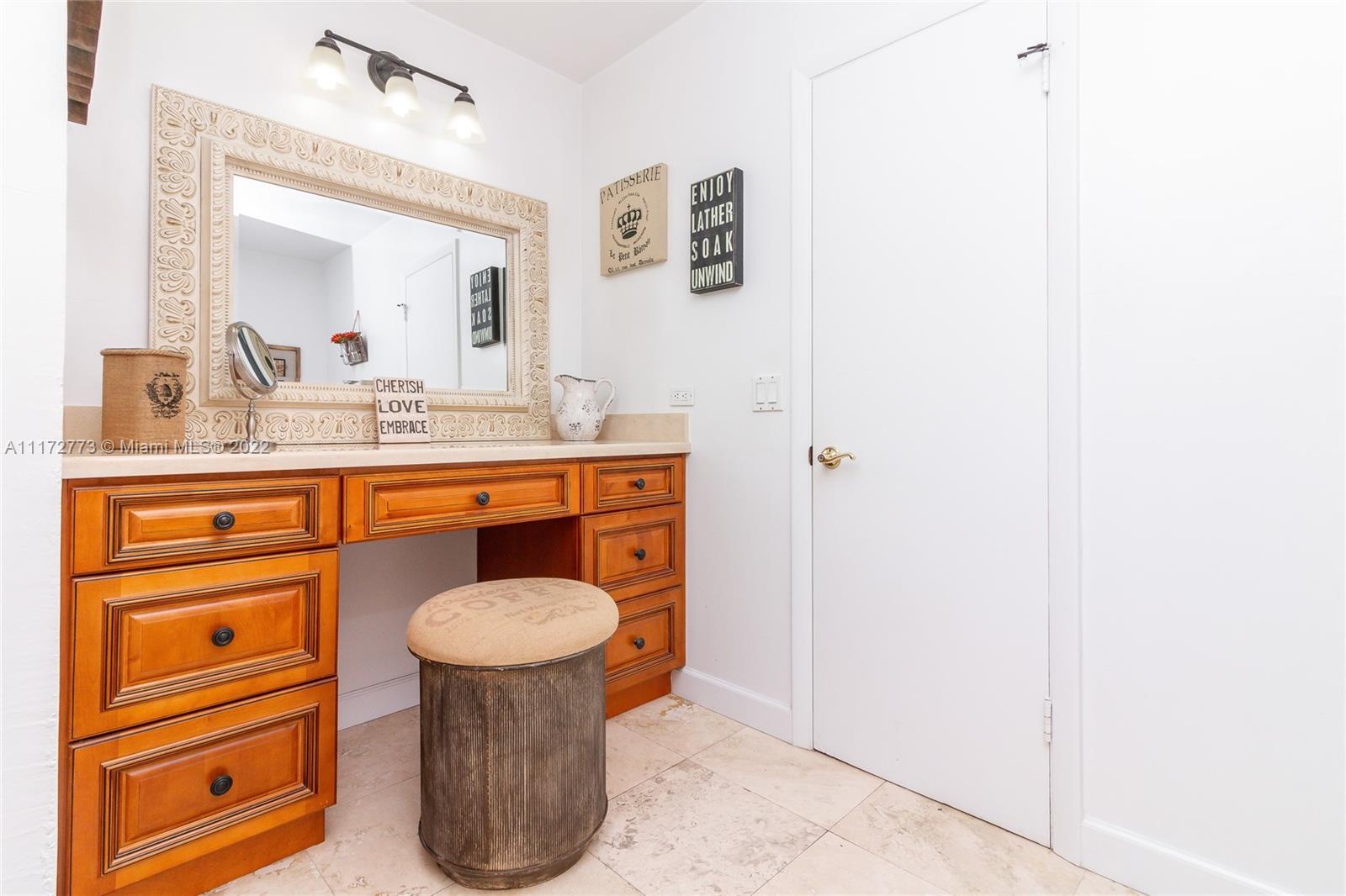 8695 Southwest 110th Street Miami, FL 33156 - Photo 28 of 54 a bathroom with a toilet sink and mirror