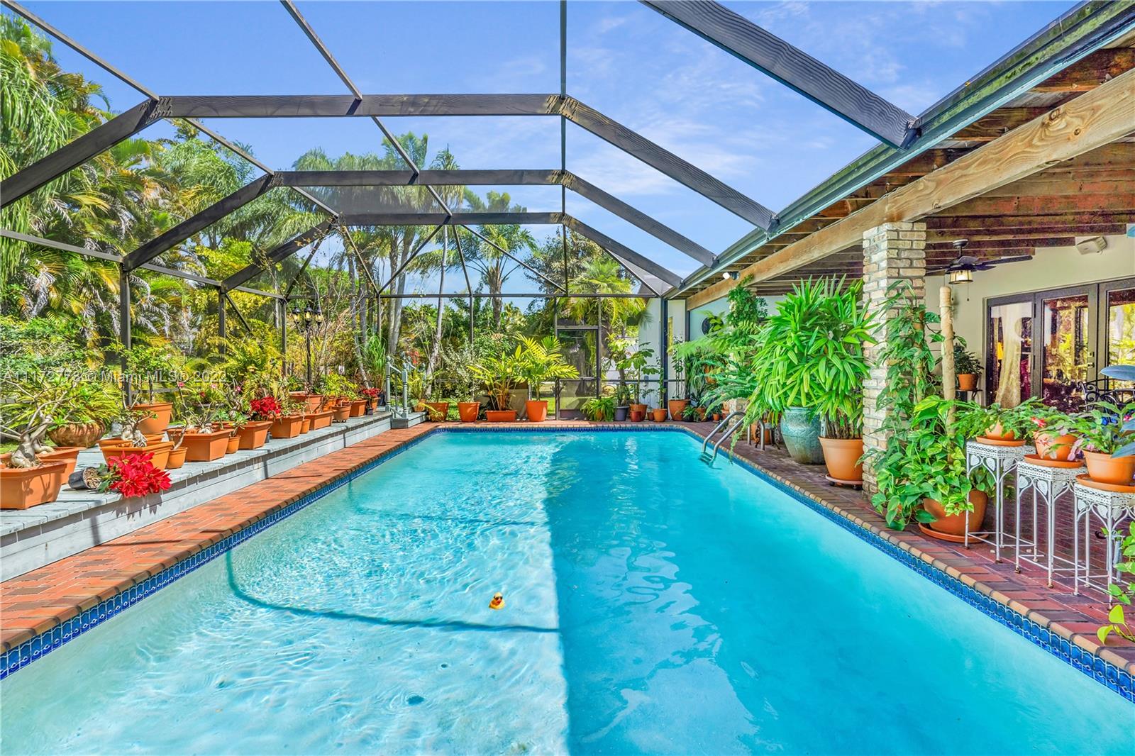8695 Southwest 110th Street Miami, FL 33156 - Photo 3 of 54 a view of a garden with an outdoor space