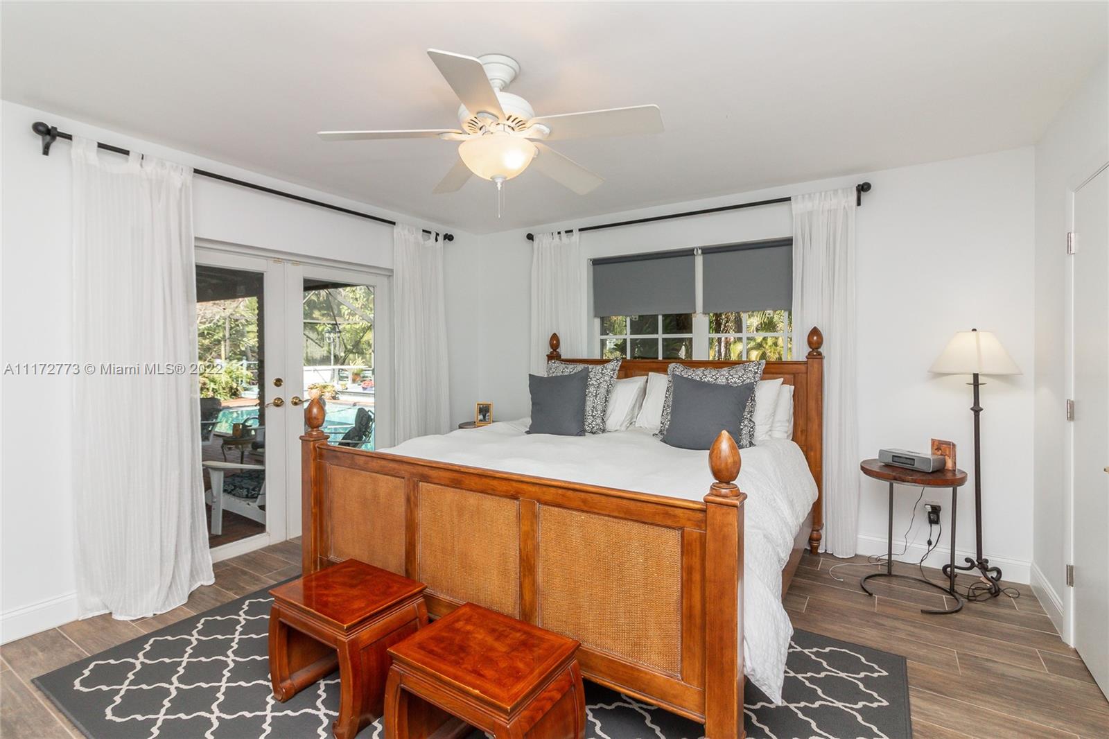 8695 Southwest 110th Street Miami, FL 33156 - Photo 33 of 54 a room with furniture a rug potted plant and a window