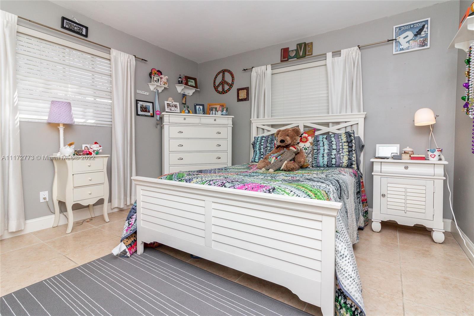 8695 Southwest 110th Street Miami, FL 33156 - Photo 34 of 54 a bedroom with a bed and a cabinets