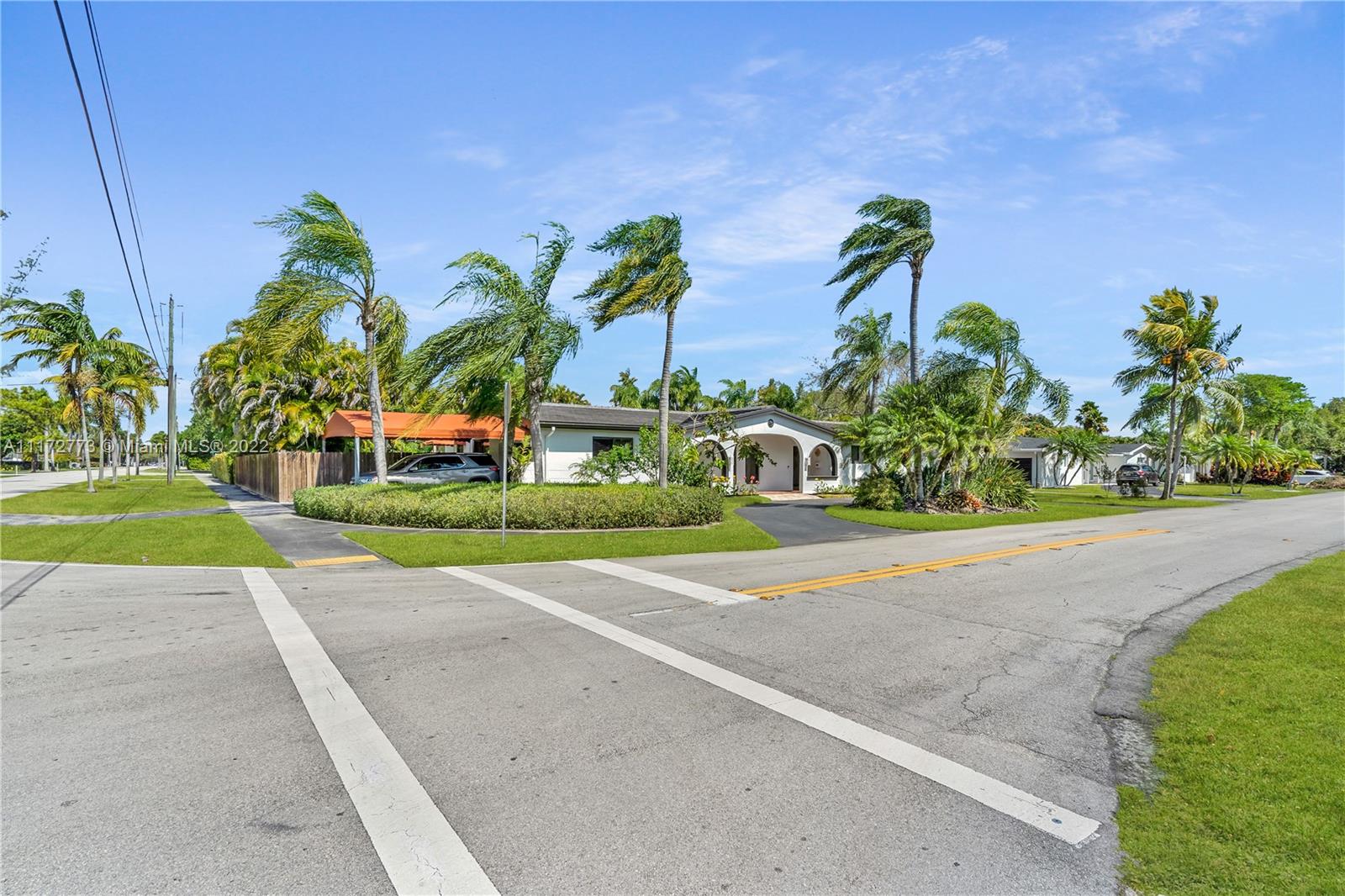 8695 Southwest 110th Street Miami, FL 33156 - Photo 40 of 54 a view of a garden with a bench