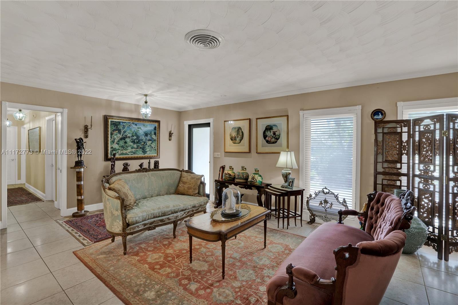 8695 Southwest 110th Street Miami, FL 33156 - Photo 42 of 54 a living room with furniture and a large window