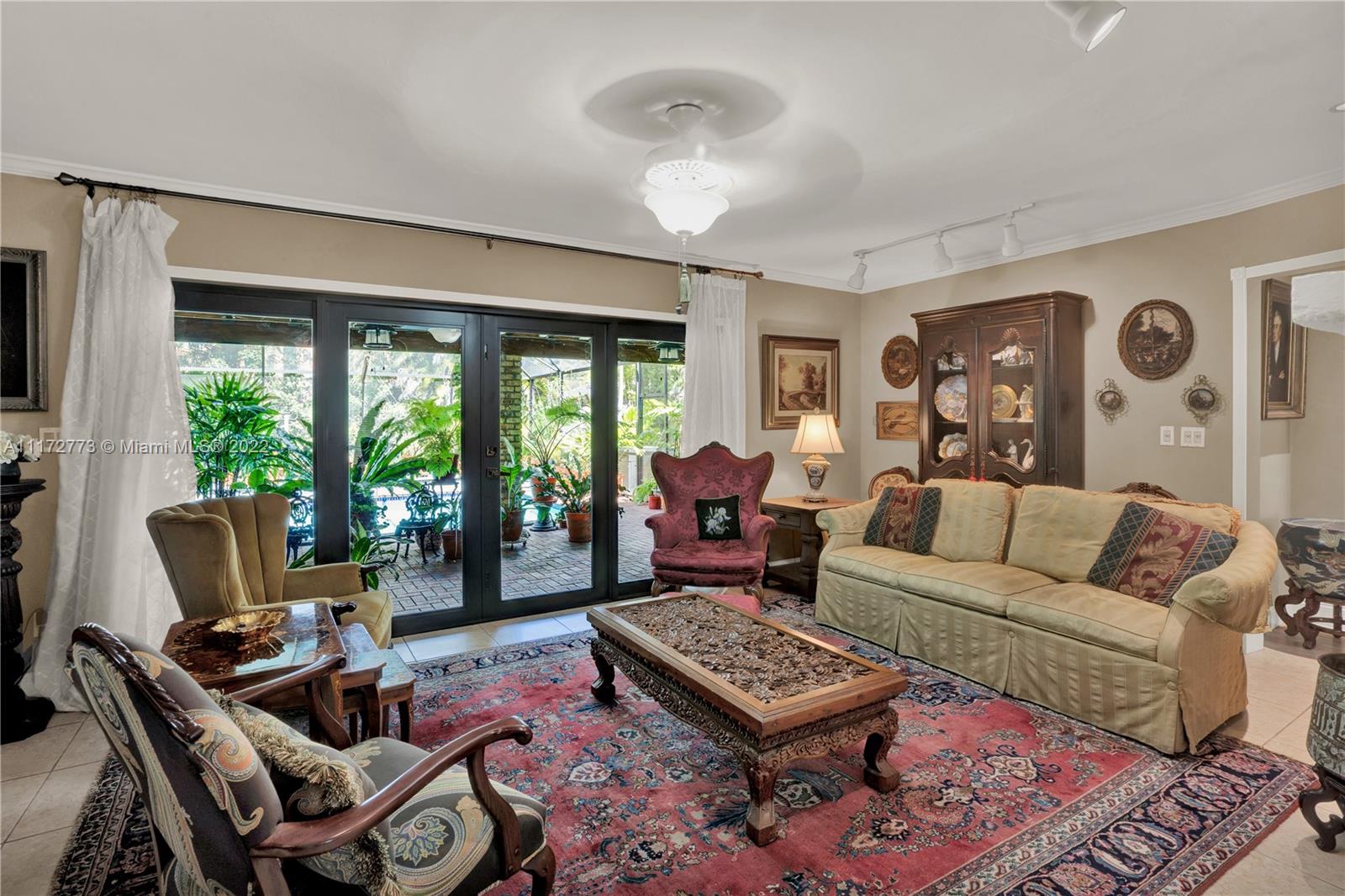 8695 Southwest 110th Street Miami, FL 33156 - Photo 44 of 54 a living room with furniture a rug and a large window